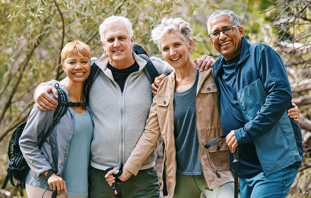 Group of older adults smiling for the camera.